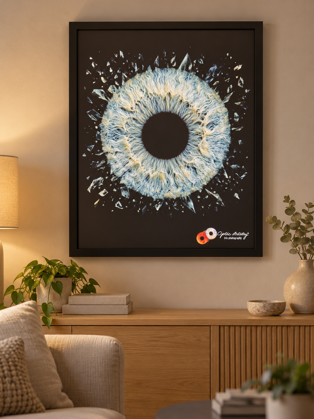 Illuminart iris artwork in a matt black frame above an oak console in a cosy living room